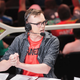 An Overwatch League caster wearing a Shanghai Dragons shirt.